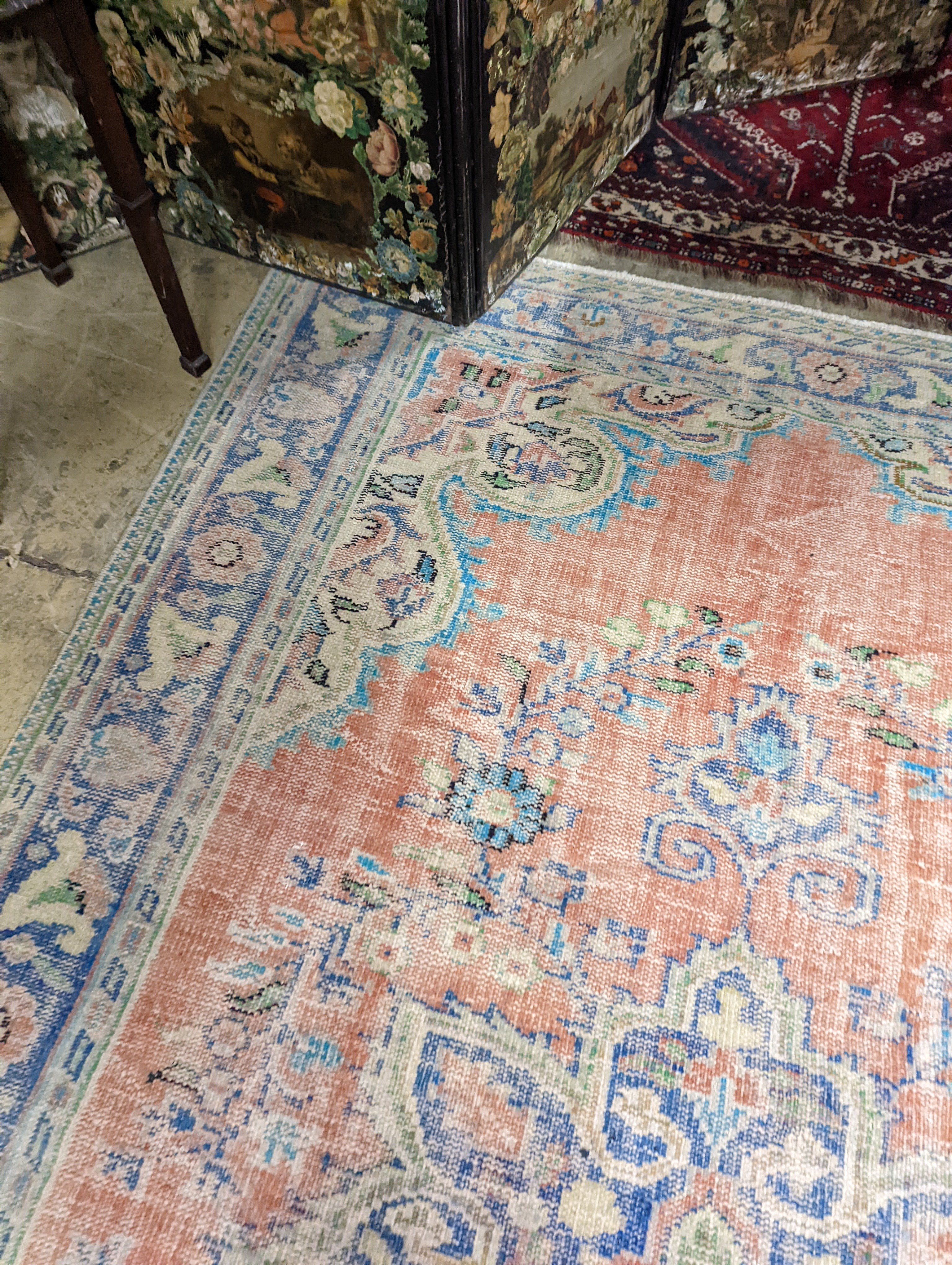 A North West Persian style faded wool carpet, 300 x 196cm